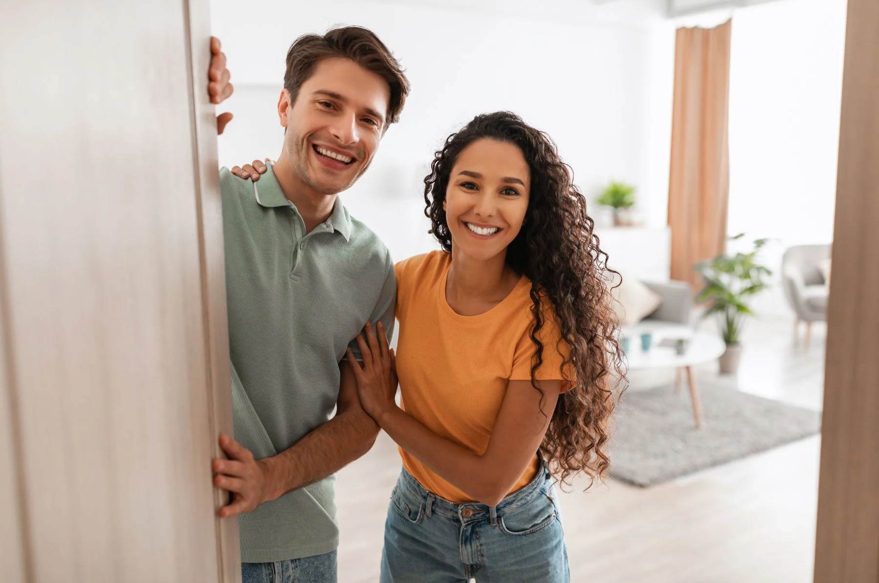couple opening a front door