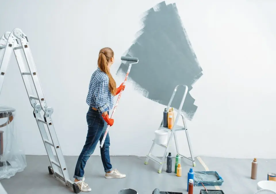 woman painting a wall